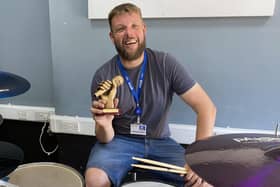 Departing St Vincent College music teacher Chris Harris with the mayor’s award he won in 2022