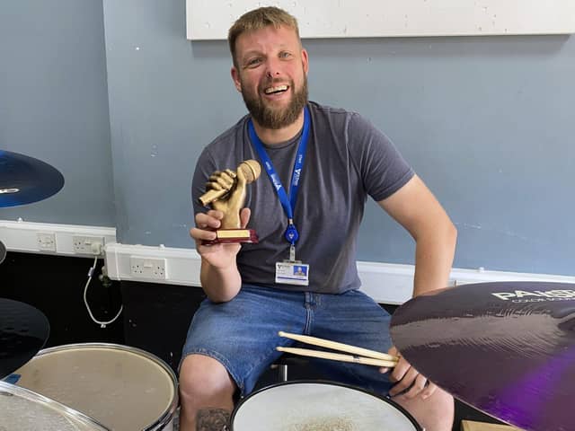 Departing St Vincent College music teacher Chris Harris with the mayor’s award he won in 2022