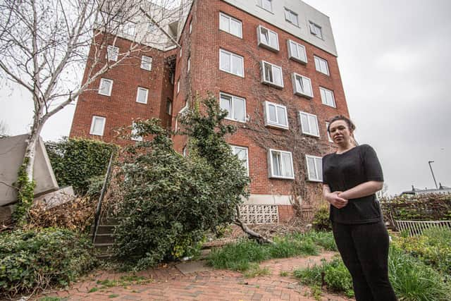 Resident Leah Hardwick next to some mattresses that have been fly tipped outside the property. Picture: Habibur Rahman