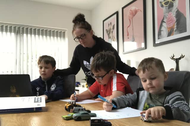 Working from home - Harry Cooper, 11 (left), mum, Josey Cooper, 32, with brothers  Jack, 8, and Charlie, 4.