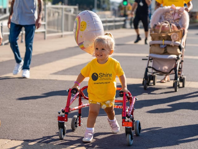 Esme Groves has spina bifida, but that didn't stop her from completing a charity walk from South Parade Pier to raise money for charity Shine.