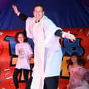 The Rev Luiz Lima on a bouncy castle