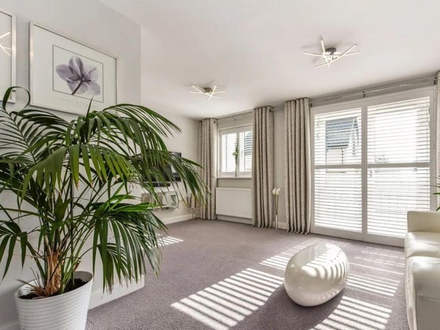 The listing says: "We are pleased to welcome to the market this stunning three bedroom semi detached townhouse yards away from the waterfront in the recent popular development of Nautilus Drive."