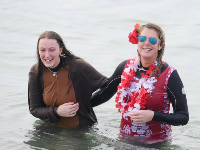 The GAFIRS New Year's Day swim has been cancelled for 2022.
Pictured is: (l-r) Alexandra Earl with her mum Rebecca from Gosport, who braved the sea anyway last year despite the organised dip being cancelled