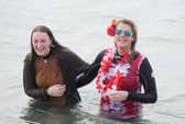The GAFIRS New Year's Day swim has been cancelled for 2022.
Pictured is: (l-r) Alexandra Earl with her mum Rebecca from Gosport, who braved the sea anyway last year despite the organised dip being cancelled