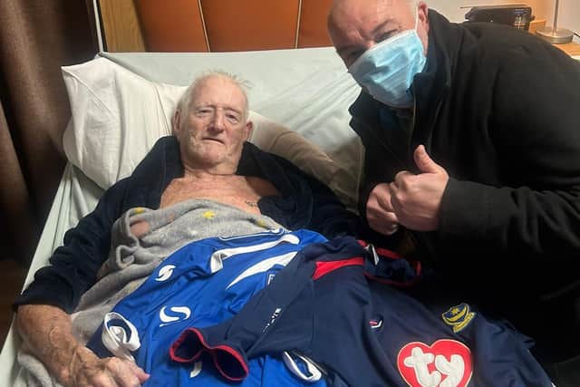 Wally with two shirts alongside donator Lance. Care home owner David Sheppard said Wally was chuffed to bits with the act of generosity. Picture: Bluewater Care Home.