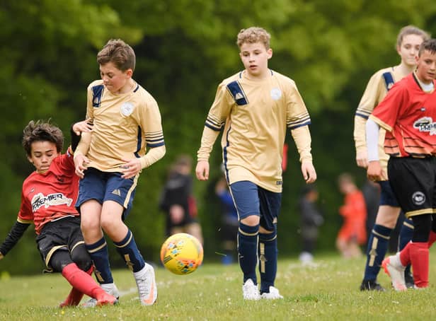 Action from Paulsgrove Black under-13s (red) Mid Solent Youth League under-13 C Division meeting with Lee Rangers White. Picture: Keith Woodland (080521-414)