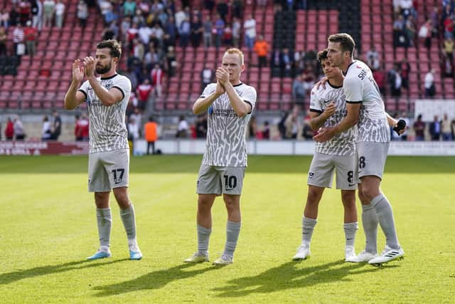 Joe Rafferty joins his Pompey team-mates in saluting the travelling fans at Leyton Orient. Pic: Jason Brown.