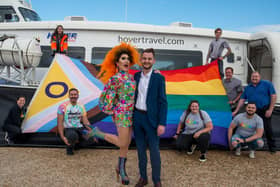 Cherry Liquor for Portsmouth Pride and Pat Sowerbutts, commercial manager at Hovertravel, with Hovertravel and Portsmouth Pride team members.