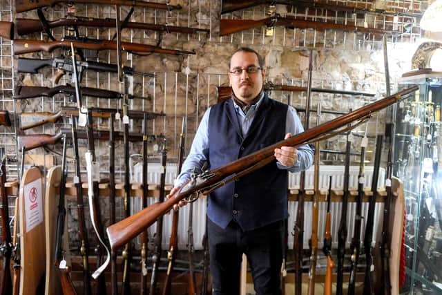 Razvan Ionascu, deputy manager at Sally Antiques and historian, with an 18th century musket used by the French Royal Liegois regiment, a precursor of the French Foreign Legion,  available for purchase. Picture: Sarah Standing (190121-1228)