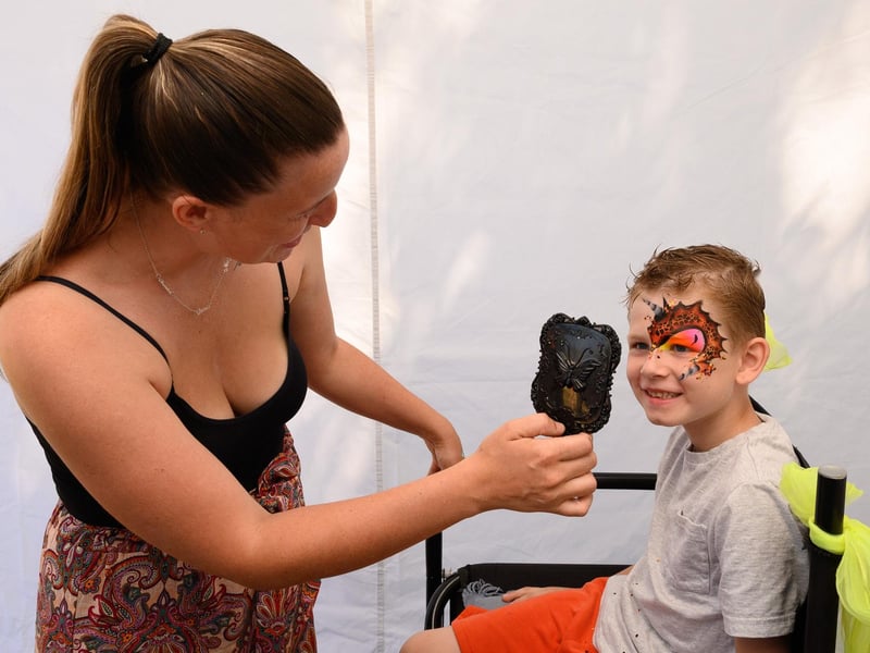 Pictured is: Logan Gilchrist admiring his dragon face paint.

Picture: Keith Woodland