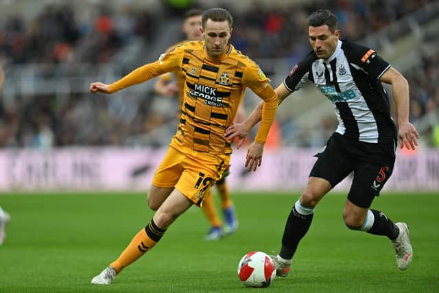 Cambridge's Adam May in action against Newcastle (Photo by PAUL ELLIS/AFP via Getty Images)