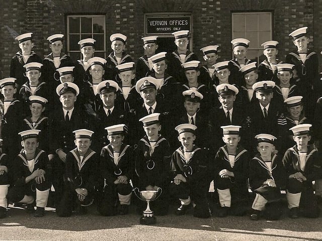 The boys of the HMS Vernon cadet corp with their trophy for winning the gun run in 1952.