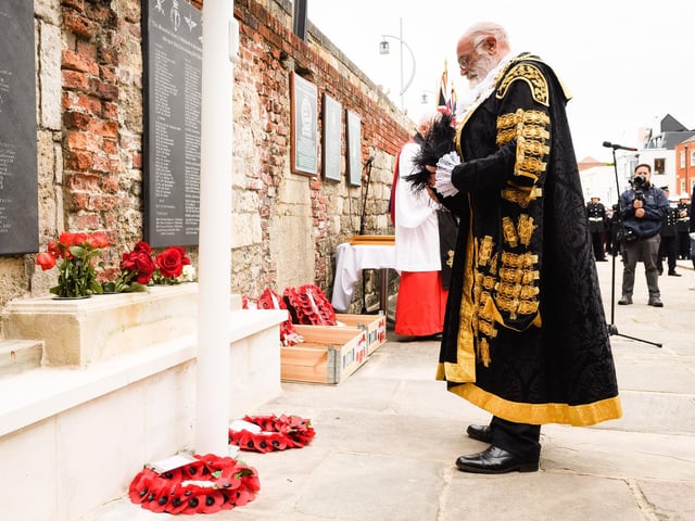 Pictured is: The Lord Mayor of Portsmouth bows his head after laying his wreath. Picture: Keith Woodland (190621-220).
