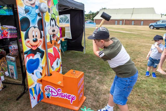 Dylan Grant, seven, rang the bell and won a prize. Picture: Mike Cooter (300722)