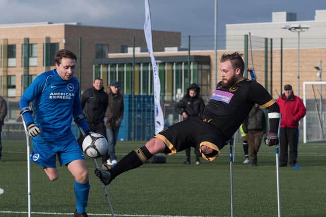 Pompey's TJ Yates fires in a shot while competing against Brighton in amputee football. Picture: Keith Woodland.