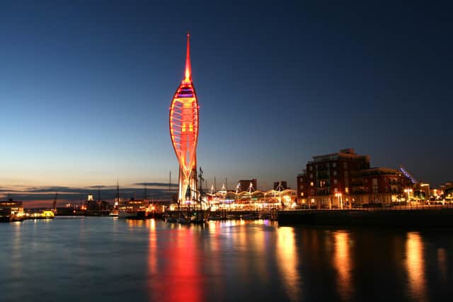 Spinnaker Tower lit up red.