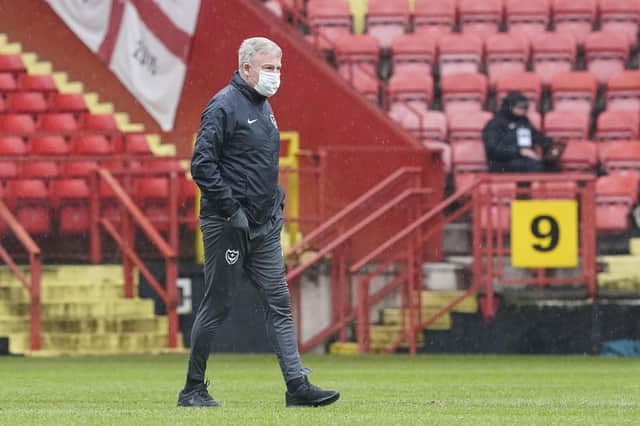 Pompey boss Kenny Jackett inspects the pitch before his side's game at Charlton was postponed. Picture: Jason Brown
