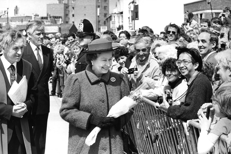 The Queen goes walkabout to meet some of the spectators gathered outside the Square Tower, Old Portsmouth in 1987. The News PP5458