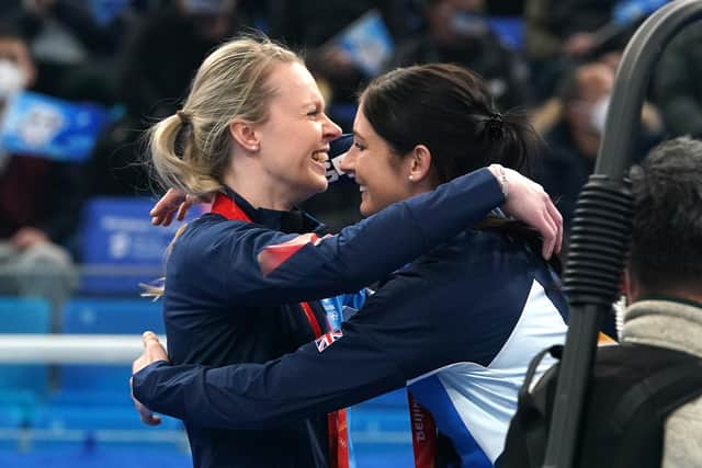 Great Britain's Vicky Wright (left) places the gold medal on Eve Muirhead after victory in the Women's Gold Medal Game against Japan during day sixteen of the Beijing 2022 Winter Olympic Games at the National Aquatics Centre in China.