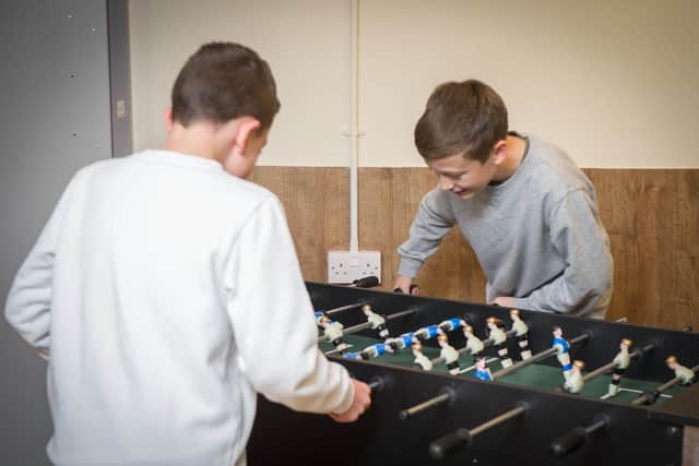 Group of residents have opened The Box at Portchester Football Club - a place for young people to socialise after school.
Pictured: Oliver and Charlie 13 playing table-top football at /the Box.
Picture: Habibur Rahman