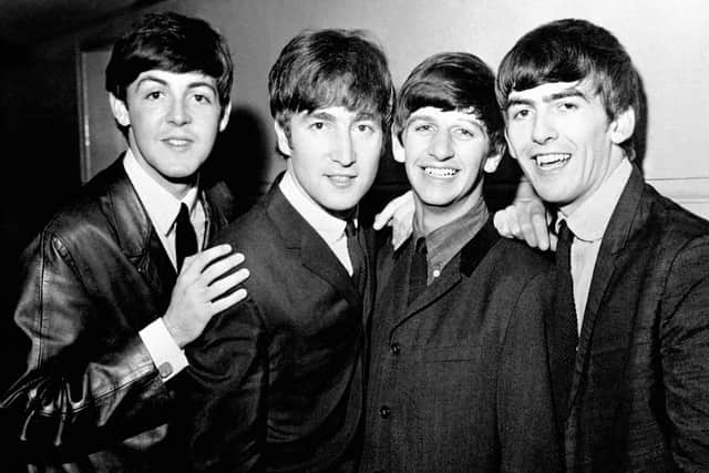 The Beatles in 1963, (left to right), Paul McCartney, John Lennon, Ringo Starr and George Harrison as their historic touchdown at JFK Airport in New York. Photo PA Wire