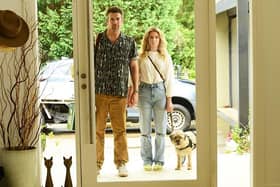 Gordon (Patrick Brammall) and Ashley (Harriet Dyer) with the canine star of the Aussie sitcom Colin From Accounts (Picture: BBC/CBS Studios/Paramount+ ©2024/Tony Mott)