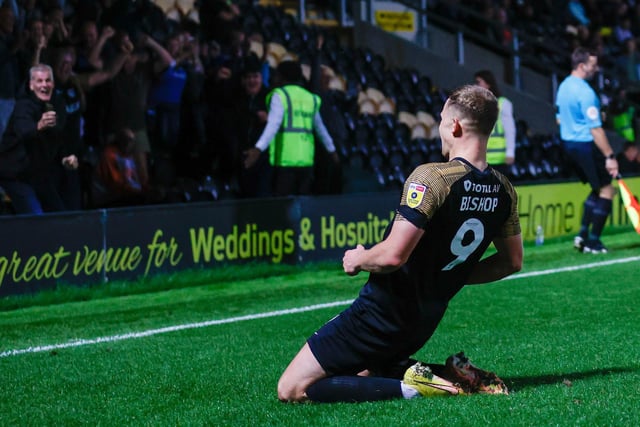 Colby Bishop celebrates in front of the 1,000 Pompey fans who made this season's trip to Burton.