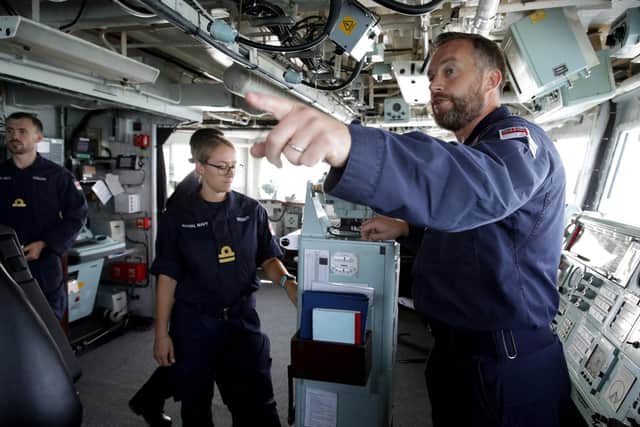 Pictured left to right: navigator 'Navs' Lieutenant Webber and and Commander Will Blackett, commanding officer of HMS Lancaster, during an exercise at sea. Photo: Royal Navy