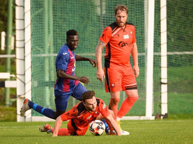 US Portsmouth's Lamin Jatta and Portchester's Charlie Williamson. Picture: Keith Woodland