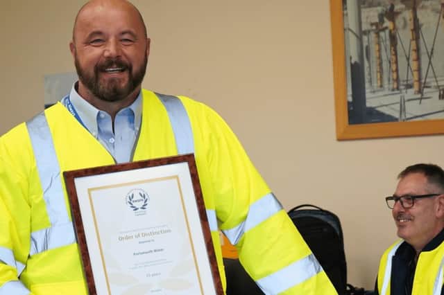 Portsmouth Water's Jamie Grady with the company's award from the RoSPA