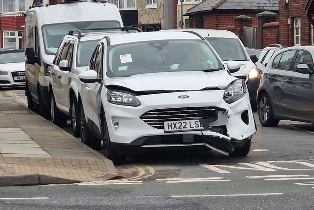 A white Ford was seen damaged at the scene.