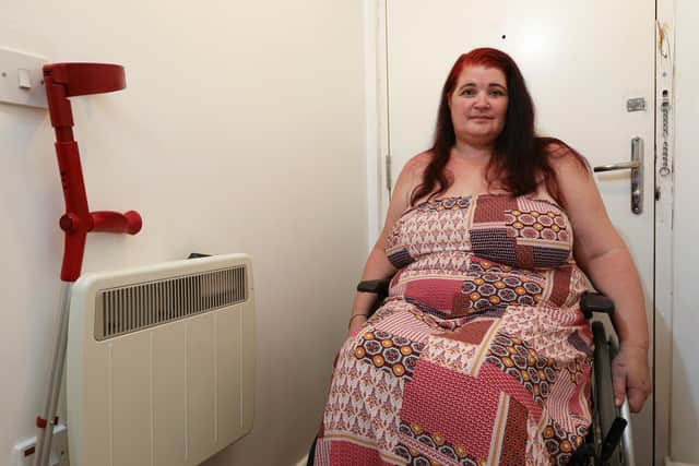 Rachel Gray feels imprisoned in her own Portsea home and alleges that Guiness Homes won't repair her front door, behind herPicture: Chris Moorhouse (jpns 120821-22)