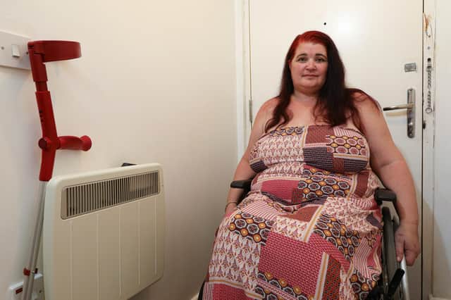 Rachel Gray feels imprisoned in her own Portsea home and alleges that Guiness Homes won't repair her front door, behind her
Picture: Chris Moorhouse (jpns 120821-22)