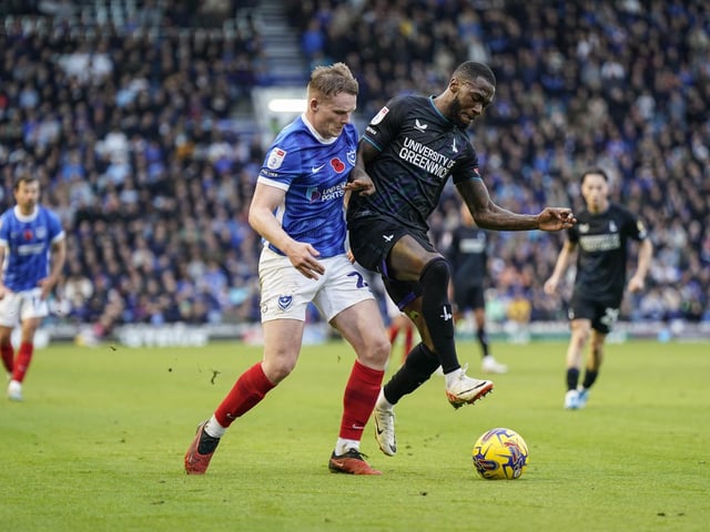 Terry Devlin attempts to win the ball off Charlton Athletic midfielder Corey Blackett-Taylor