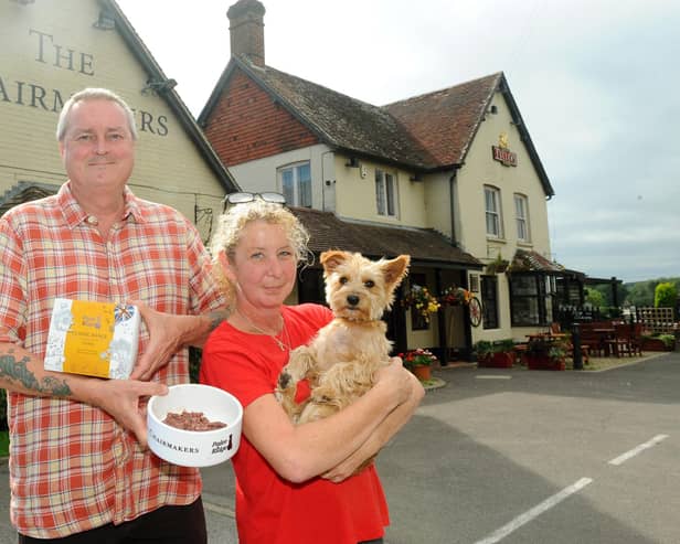 Landlords of The Chairmakers Angus and Sherry Reid with their dog Toffee. Picture: Sarah Standing