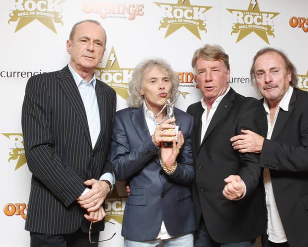 John Coghlan, pictured on the right alongside Francis Rossi, Alan Lancaster, Rick Parfitt at the Classic Rock Roll of Honour awards at The Roundhouse in London on November 13, 2012, is set to perform a farewell tour in Portsmouth. Photo by Jo Hale/Getty Images.