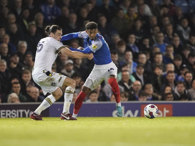 Reeco Hackett tries to get past Oxford defender Ciaran Brown