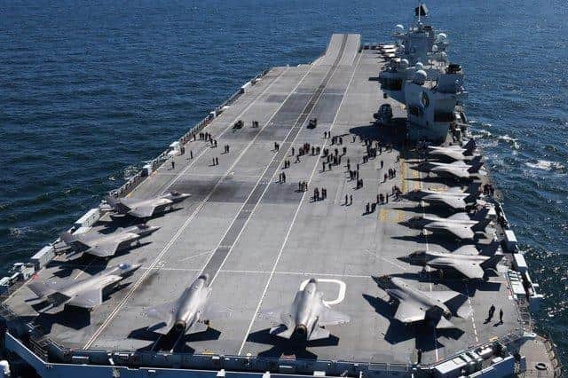 HMS Queen Elizabeth pictured with her embarked squadron of British and American F-35 jets.Photo: Royal Navy.