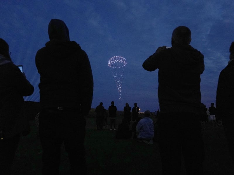 Drones make a parachute during a drone display telling the story of D-Day above the coastline in Portsmouth, Hampshire, at the end of the BBC broadcast of the Great Vigil, ahead of the 80th anniversary of D-Day. Picture date: Wednesday June 5, 2024.