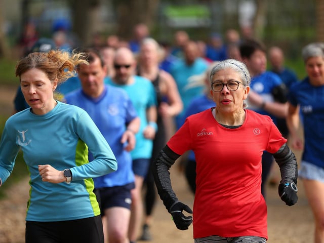 Zoe Gill, left, was the second woman finisher in the 500th Havant parkrun at Staunton Country Park. Picture: Chris Moorhouse (jpns 220423-009)