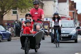 Kevin Watkins pedals his son Max, seven, and Emma Strong in his cargo bike
Picture: Chris Moorhouse (jpns 060621-37)