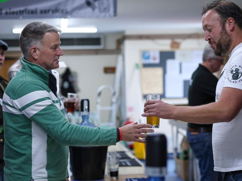 Ian Stoddard, left, is served with his beer. Wickham Beer Festival, Wickham Community Centre
Picture: Chris Moorhouse (051024-056)