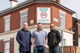 Local traders in front of the newly erected sign on Tangier Road. Pictured: Adam Fitt (42) from Baffins Barber Room, local campaigner Joe Standen (36) and Gauthaman Arumugam (41) from Premier Stores. Picture: Mike Cooter (05042023)