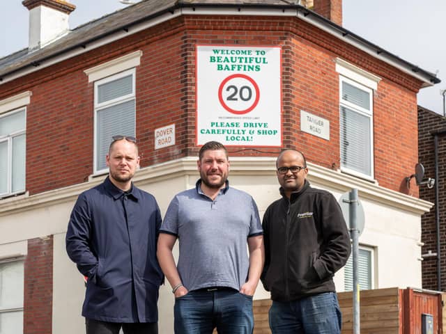 Local traders in front of the newly erected sign on Tangier Road. Pictured: Adam Fitt (42) from Baffins Barber Room, local campaigner Joe Standen (36) and Gauthaman Arumugam (41) from Premier Stores. Picture: Mike Cooter (05042023)