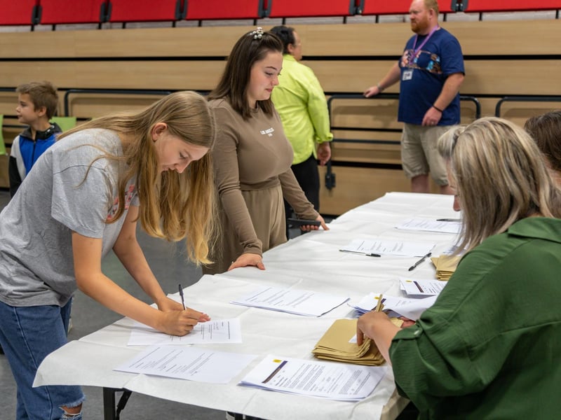 Students at Havant Academy sign for their GCSE results. Picture: Mike Cooter (240823)