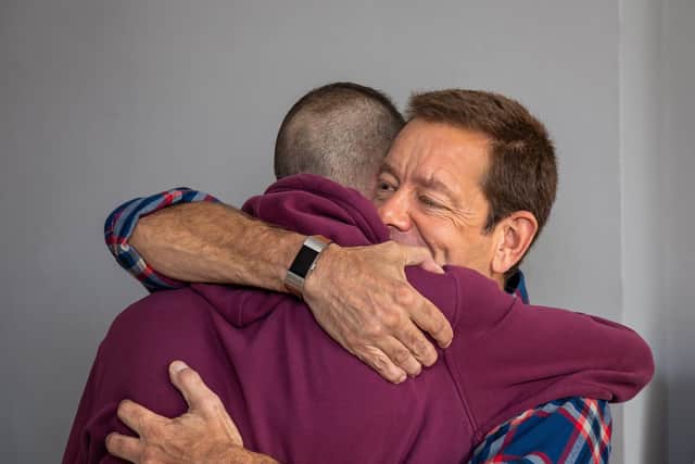 A hug for kidney donor Gareth Hoole (37) from recipient Jeremy Penny (51). Picture: Mike Cooter (291021)