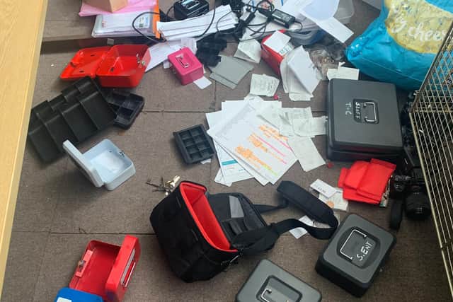 Files, camera bags and empty collection tins left scattered on the floor of the Buckland United Reformed Church following a break-in over the weekend.