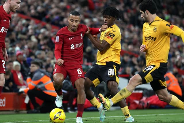 Thiago Alcantara is challenged by Wolves starlet Dexter Lembikisa. (Photo by Naomi Baker/Getty Images)