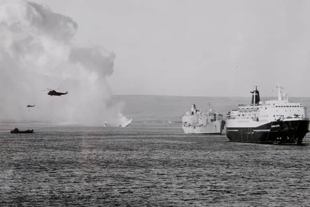 WEDNESDAY FEBRUARY 27 2002 NORTH SEA FERRIES NORLAND FINAL SAILING FOR FALKLANDS SHIP
The P&O North Sea Ferries' Norland, right, under fire in San Carlos Bay in May 1982 as HMS Antelope is sunk by the Argentinian Air Force during the Falklands conflict.